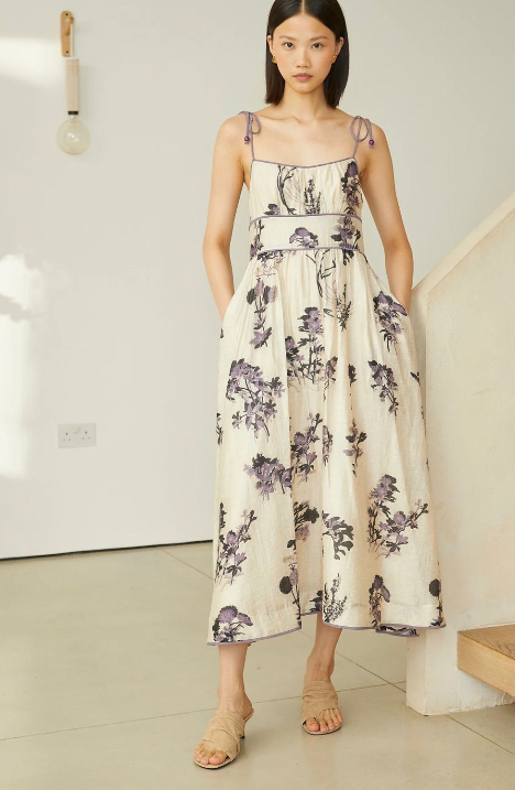 Vestido estampado inspiración japo con ribetes y bolsillos a los lados